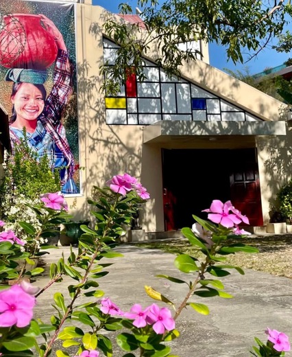 Beikthano Gallery exterior with mural and flowering garden, Yangon