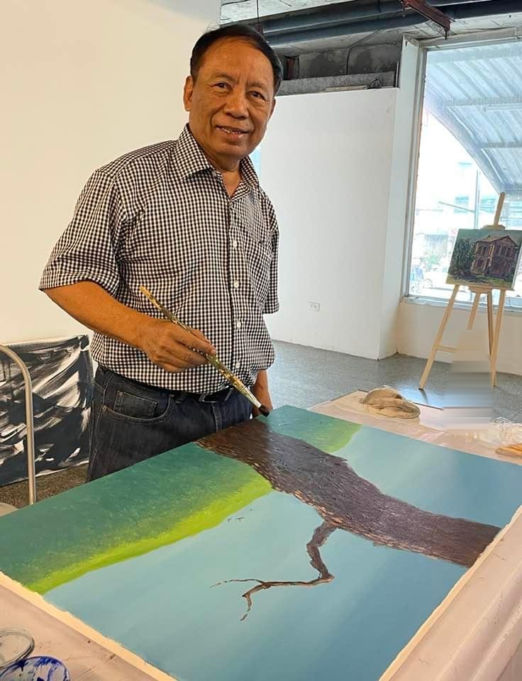 Tin Win painting in his studio